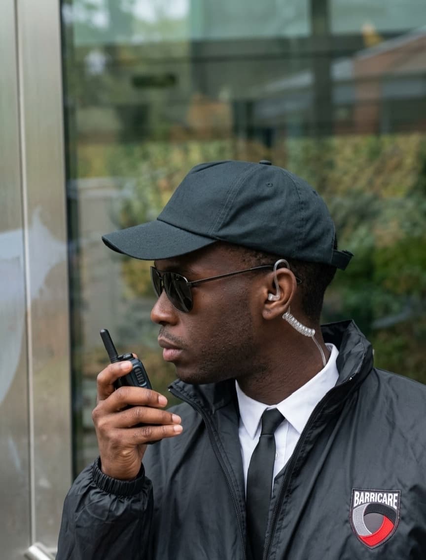 Security officer speaking into a radio