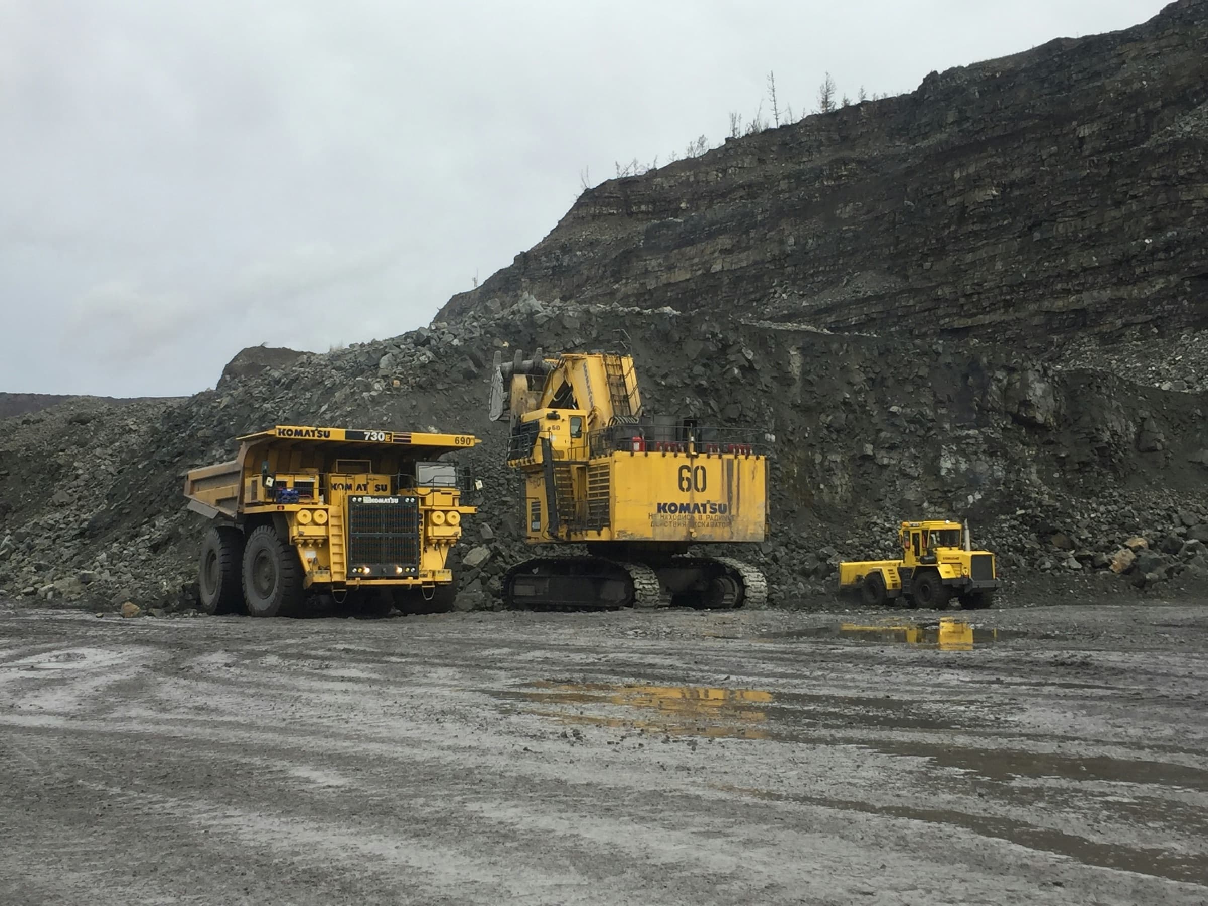Mining haul truck and excavator at an open-pit mine